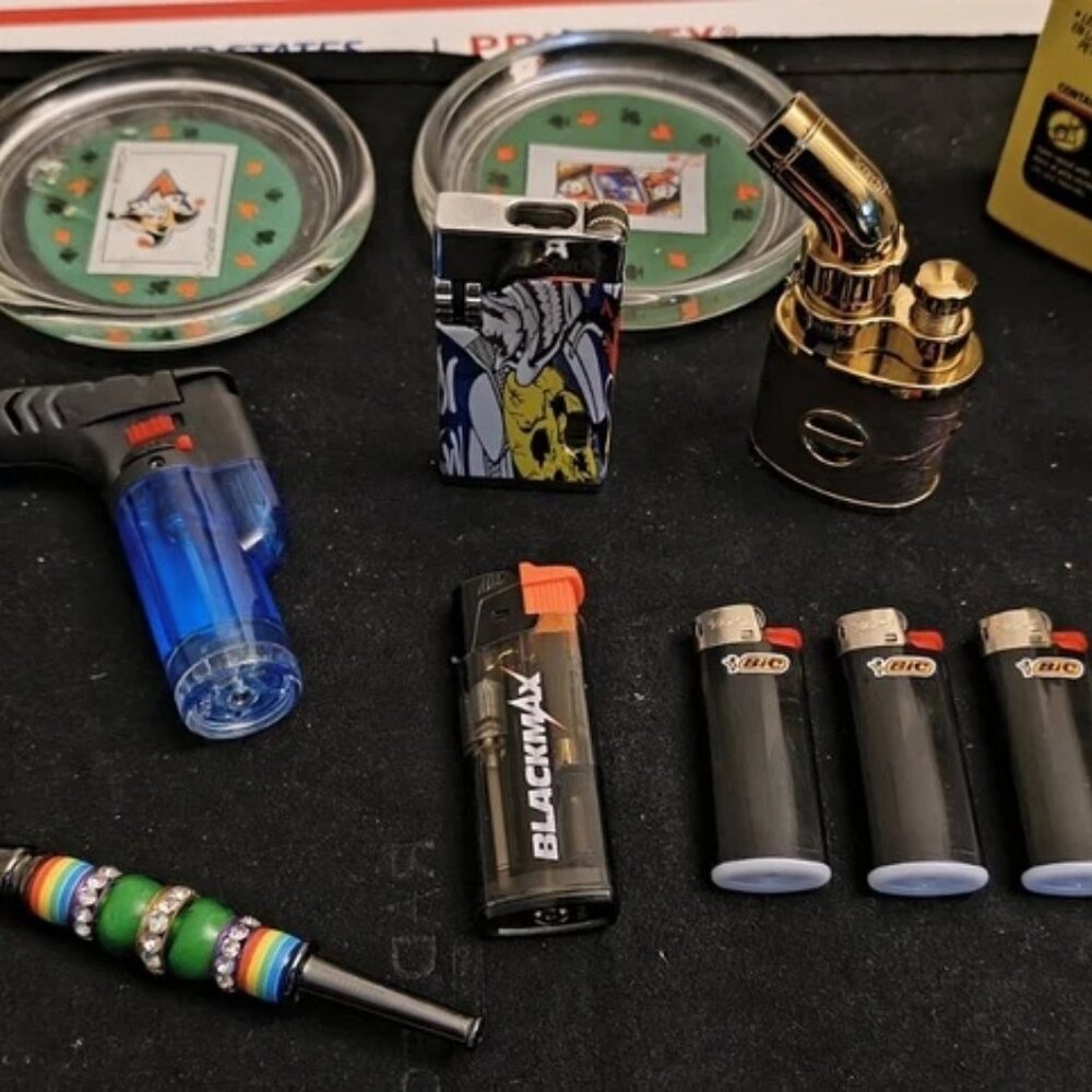 Collectors Edition Assorted variety of lighters Zippo w/fluid/Pipe/Turning Ston